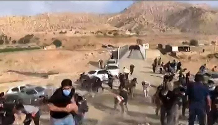 The photo grab from a UGC video shows Iranian security forces clashing with crowds outside the western city of Khorramabad on October 27, 2022 || AFP Photo